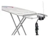 A close-up view of an ironing board with an attached electrical outlet and cord. Náhľad obrázku produktu