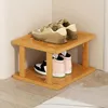 A wooden shoe rack with shoes on it, placed in a corner of a room. Produktbild-Vorschau