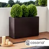 A rectangular planter box with plants on a balcony. Produktbild-Vorschau