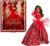 A Barbie doll in a red dress, shown both in its packaging and outside of it. Náhľad obrázku produktu