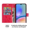 A red wallet-style phone case is open, showing slots for cards and cash, and a smartphone is inserted. Produktbild-Vorschau
