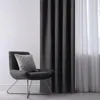 A chair with a pillow next to a set of curtains. Produktbild-Vorschau