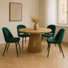 A dining room scene with a round wooden table and four green velvet chairs. Náhled obrázku produktu