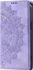 A close-up view of a purple flip phone case with a mandala embossed pattern. Produktbild-Vorschau