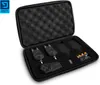 A black protective case with foam padding, containing fishing bite alarms and batteries. Produktbild-Vorschau
