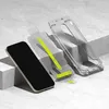 A smartphone, a screen protector, and a phone case are arranged on a textured surface with geometric blocks. Anteprima dell’immagine prodotto