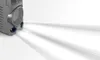A close-up of a gray entertainment center with two blue lights emitting beams of light. Produktbild-Vorschau