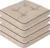A stack of four beige seat cushions with dark brown piping. Náhled obrázku produktu