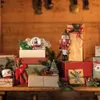 A collection of Christmas gifts and decorations arranged on a wooden shelf. Podgląd zdjęcia produktu
