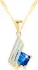 Ensemble collier en or avec cristal bleu et boucles Voir les images du produit 2