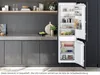 A modern kitchen scene with an open refrigerator. Produktbild-Vorschau