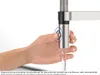 A hand is shown pressing a button on a kitchen faucet, with water flowing out. Anteprima dell’immagine prodotto