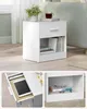 A white nightstand with a drawer and an open shelf is shown in different views. Produktbild-Vorschau