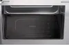 Close-up view of the interior of a microwave oven, showing the turntable and the inside walls. Produktbild-Vorschau
