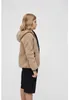 A young person is shown from the side wearing a beige fleece jacket and black shorts. Produktbild-Vorschau