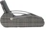 A side view of a gray rattan lounger with a gray cushion. Produktbild-Vorschau