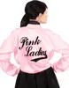 A woman wearing a pink satin jacket with "Pink Ladies" embroidered on the back, and a black skirt. Anteprima dell’immagine prodotto