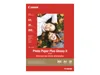 A package of Canon Photo Paper Plus Glossy II with a picture of two smiling people on it. Anteprima dell’immagine prodotto
