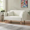 A living room scene with a sofa, side table, and artwork. Anteprima dell’immagine prodotto