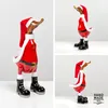 A collage of three images showing a hand-painted wooden duck figurine dressed as Santa Claus. Produktbild-Vorschau