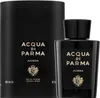 A black perfume bottle and its cylindrical packaging are shown against a white background. Anteprima dell’immagine prodotto