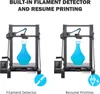 Two 3D printers are shown side-by-side, each printing a blue vase. The left printer highlights its filament detector feature with an icon of a broken filament, and the right printer highlights its resume printing feature with an icon of a power plug and li Náhled obrázku produktu