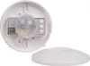The back of a white ceiling motion detector with its cover removed, showing the internal components and a separate white cover. Anteprima dell’immagine prodotto