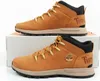 Two Timberland Sprint Trekker Mid shoes are displayed side-by-side on a white background. Produktbild-Vorschau