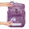 Hands are shown attaching patches to a purple backpack. Náhled obrázku produktu