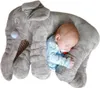 A baby sleeping on a large plush elephant pillow. Produktbild-Vorschau