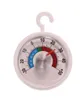 A close-up shot of a round, white thermometer with a hook for hanging. Podgląd zdjęcia produktu