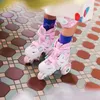 Kinder-Rollschuh-Set Cariboo Ballerina + pinke Schützer - Produktbild-Vorschau 6