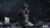 A soldier in tactical gear with night vision goggles stands in the rain, holding a rifle. The scene is dark and atmospheric, with debris scattered around. Produktbild-Vorschau