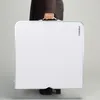 A person is holding a folded white table. Anteprima dell’immagine prodotto