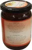A close-up view of a glass jar containing a dark brown liquid, with a label on the front. Anteprima dell’immagine prodotto
