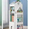 A white, house-shaped bookshelf filled with books and small decorative items. Produktbild-Vorschau