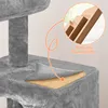 A close-up of a grey cat tree, highlighting its construction with an inset circle showing layered particle board. Podgląd zdjęcia produktu