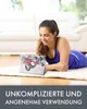 A woman is lying on the floor, looking at a tablet with a floral case. Produktbild-Vorschau