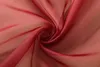 A close-up of draped red fabric, showing its texture and folds. Produktbild-Vorschau