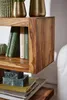 A close-up of a wooden shelf with books and decorative items. Produktbild-Vorschau