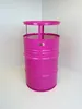 A pink barrel-shaped table standing in a corner against a white wall. Produktbild-Vorschau