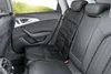 The interior of a car with a child seat protector on the back seat. Produktbild-Vorschau