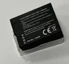 A black battery pack with white text and symbols, resting on a clear plastic holder. Produktbild-Vorschau