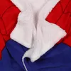 A close-up view of a folded blanket with a fuzzy white lining and a red and blue exterior. Náhled obrázku produktu