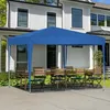 A blue pop-up canopy tent is set up over a wooden table and chairs on a paved patio in front of a white house. Produktbild-Vorschau