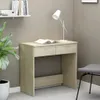 A desk with a book and a lamp, next to a plant and a chair. Náhled obrázku produktu