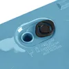 Close-up of a blue plastic object with a black rubber plug and instructions for draining excess water. Anteprima dell’immagine prodotto