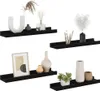 Four black wall shelves are displayed against a white background, each decorated with various home decor items. Podgląd zdjęcia produktu