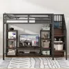 A loft bed with a TV stand and storage shelves. Produktbild-Vorschau