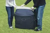 Two people are shown setting up or packing away a large inflatable spa cover on a grassy lawn. Produktbild-Vorschau